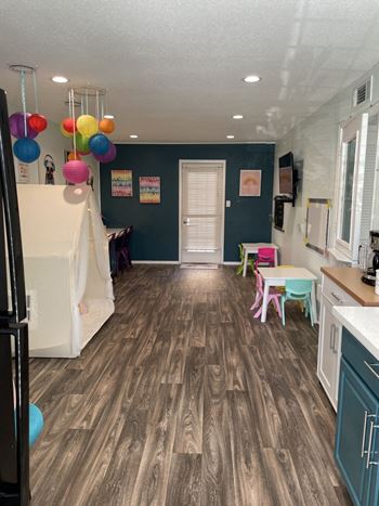 Colorful playroom with kids furniture and paper lanterns